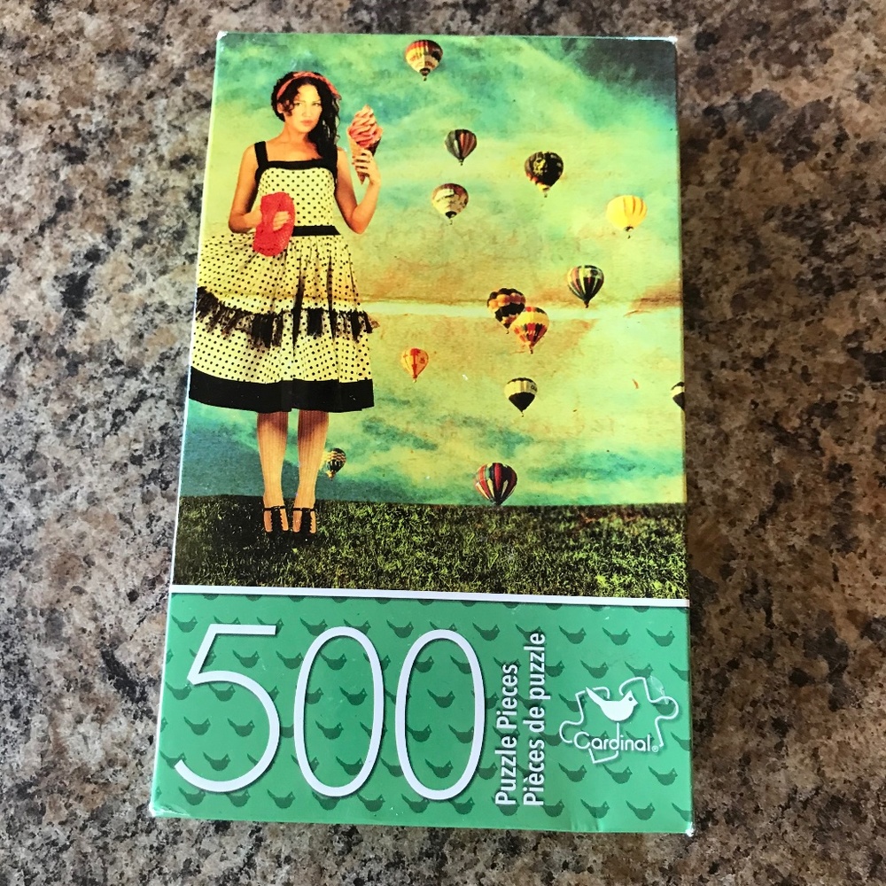 B1 500 Piece Cardinal Puzzle Woman With Ice cream and Air Balloons In Field